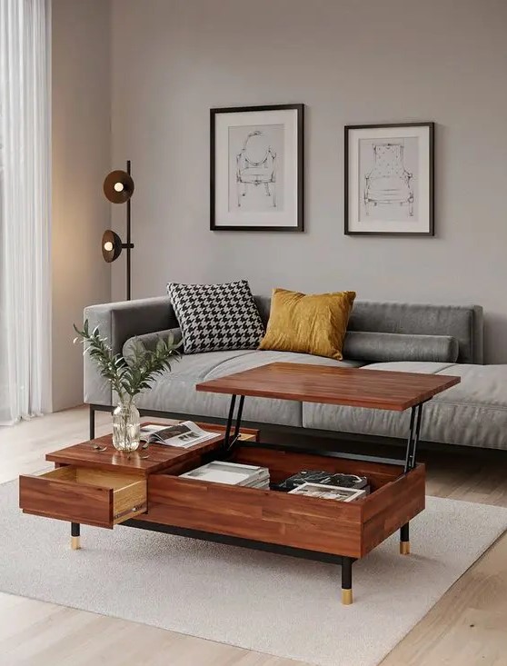 an elegant greige mid-century modern living room with a grey couch, a mini gallery wall, a pretty coffee table with a raising tabletop