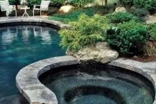 stone is a great material for pools and outdoor jacuzzis because it blends with surroundings really well.