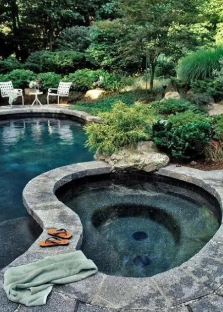stone is a great material for pools and outdoor jacuzzis because it blends with surroundings really well.