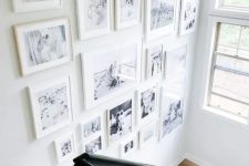 a beautiful free form gallery wall with white mismatching frames is a cool and chic idea and will add coziness