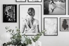 a black and white free form gallery wall with no matting and thin black frames is a cool and stylish solution