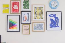 a bright gallery wall with bold posters and prints in mismatching frames will add a cool and cheerful touch to the space