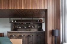a contemporary home with a wood slat accent wall and a ceiling, a timber home bar and stylish contemporary seating furniture