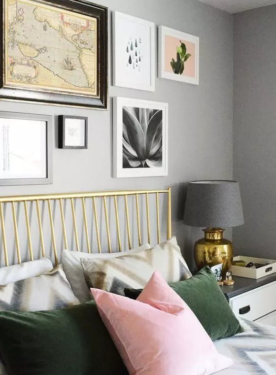 a creative gallery wall that includes a vintage map and some plant prints is a lovely decor idea for a bedroom