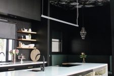 a dark dramatic kitchen with a moody floral wallpaper ceiling that adds charm and makes the space look softer