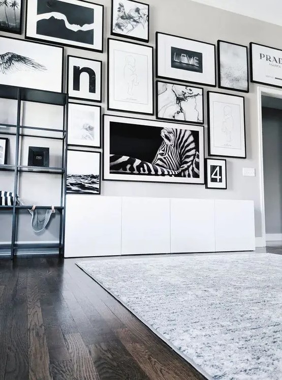 a fab black and white free form gallery wall with matching black frames and matting or no matting is a chic idea