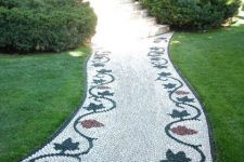 a fantastic pebble garden path with red and black leaves is a beautiful idea for a vintage-inspired outdoor space