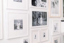 a free form gallery wall with mismatching frames, black and white photos is a stylish and chic idea with an eclectic feel