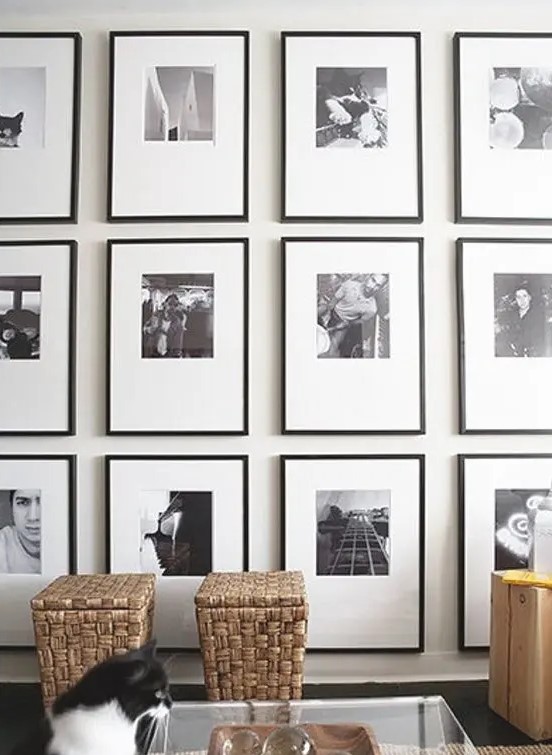 a grid black and white gallery wall made eye catchy with asymmetrical matting and thin black frames