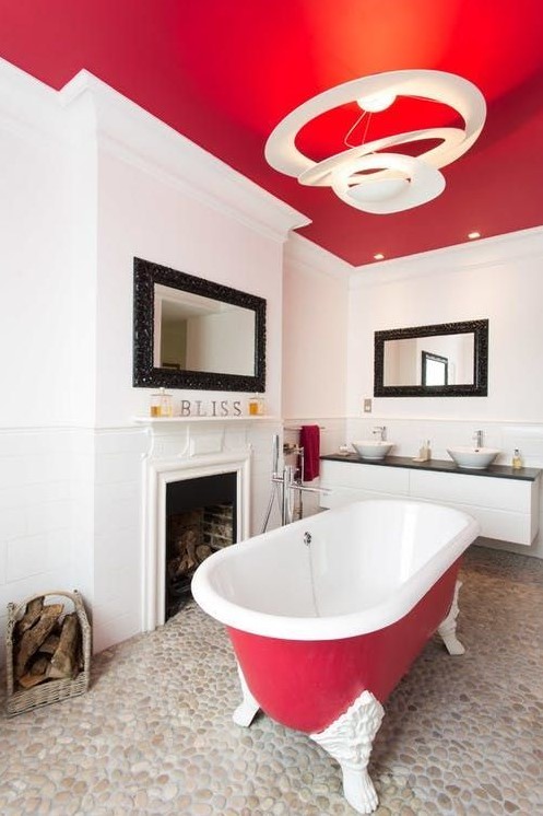 a hot red ceiling and an echoing bathtub make the space bold and add personality to it at once