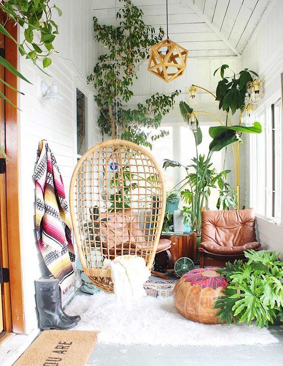 a lovely sunroom with a tree stump