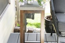 a small and cool side table of wood and concrete is a nice solution for a modern outdoor space is a lovely idea to rock