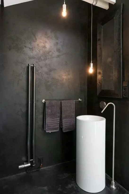 a moody dark bathroom design