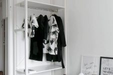 06 a small Scandinavian makeshift closet with shelves and a rack with clothes hangers plus a basket are great for those with a minimal wardrobe
