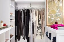 13 a small and glam closet in white, with built-in shelves and wardrobes, with an open storage cabinet and a glam crystal chandelier