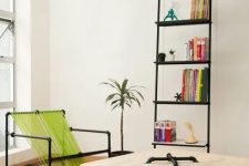 18 a bold modern nook with an exposed pipe shelving unit, a pipe and neon green twine chair, a coffee table or plywood and pipes is a cool space