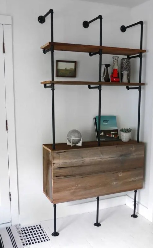 a shelving and storage unit of black pipes and reclaimed wood is a lovely idea for an awkward nook, it's a smart solution