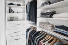 28 a small Nordic closet with open shelves, holders for clothes hangers and some built-in drawers is a cool idea