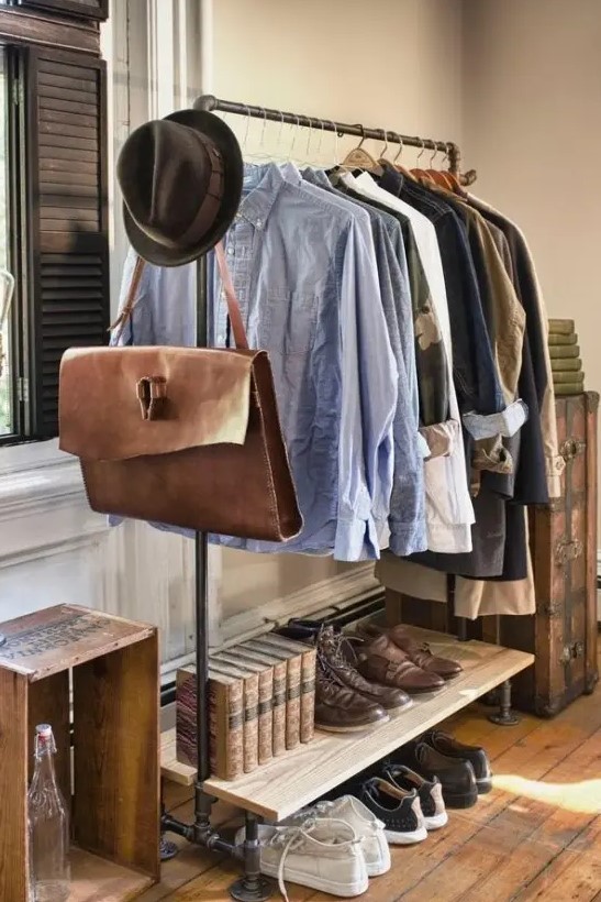a stylish and laconic exposed pipe clothes and shoe rack with several tiers is a lovely idea for a masculine or industrial space