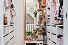 31 a small vintage-inspired sweet closet with a large mirror, a crystal chandelier, open shelves and holders plus drawers