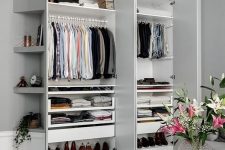 35 a stylish small built-in closet with shelves up and down and some holders for clothes hangers is a perfect idea