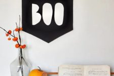 40 a simple BOO sign of black paper or fabric can be hung anywhere you want, perfect for modern Halloween decor