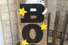 50 colorful BOO sign with yellow stars, a funky ghost, an orange pumpkin and some ribbon decor