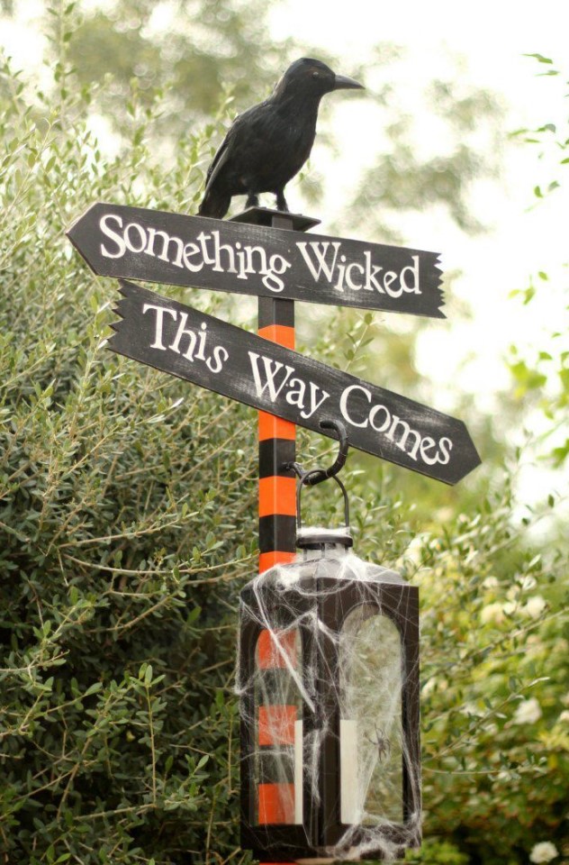 decorate any post in your backyard with a cool Halloween arrangment with several signs
