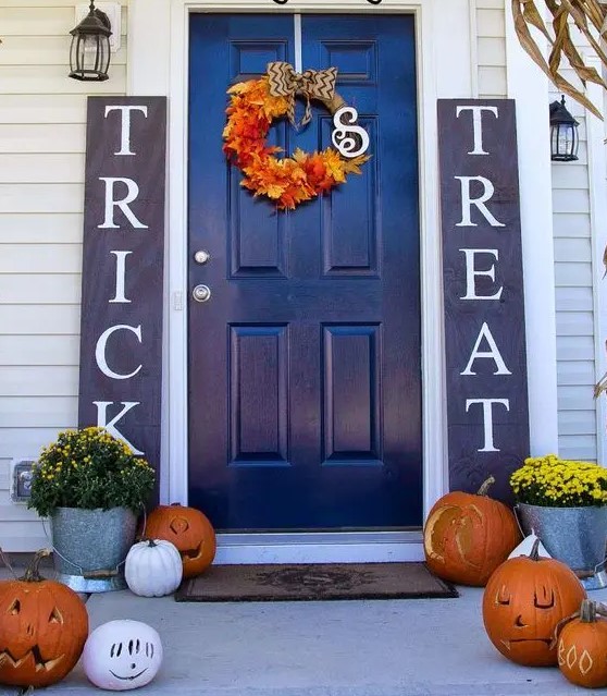 stylish navy and white sidelight signs for a bold Halloween front door and a porch