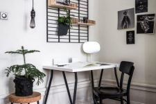 a simple home office design with a b&w gallery wall