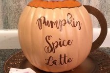 a beautiful idea to turn a pumpkin into a pumpkin spice latte with just painting and gluing some pieces is amazing