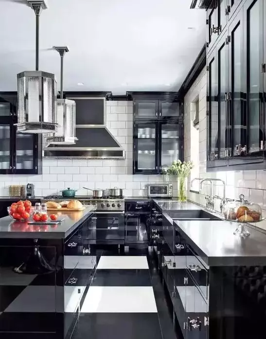 a bold art deco black and white kitchen with black cabinets with glass doors, a striped floor, glossy black cabinets and concrete countertops