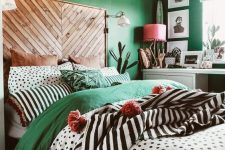 a cozy bedroom with a bed with a wooden headboard