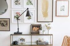 a chic gallery wall with thin frames and botanical theme as the main one feels very spring-like