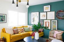 a cute living room with a green accent wall