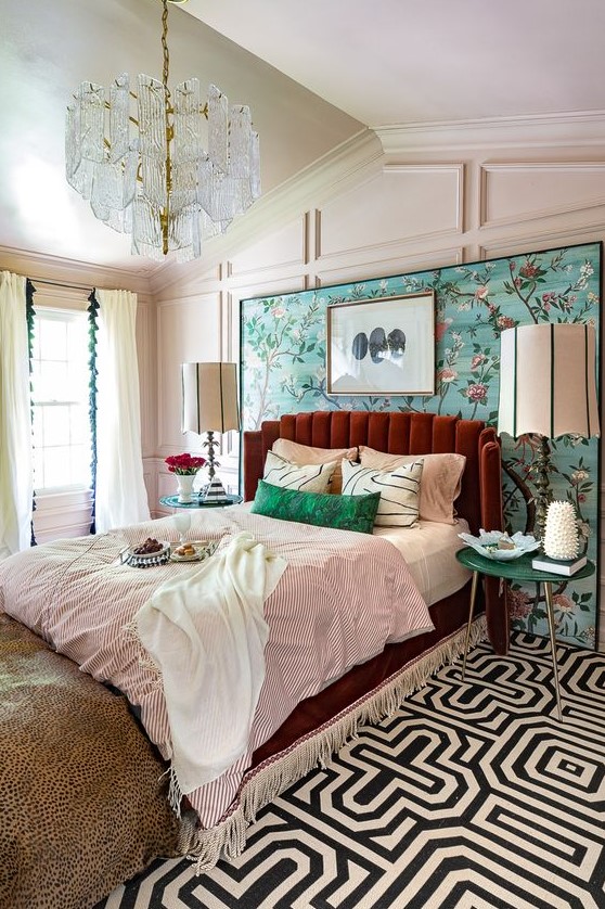 a colorful eclectic sleeping area done in aqua, emerald, burgundy and with touches of gold plus various prints