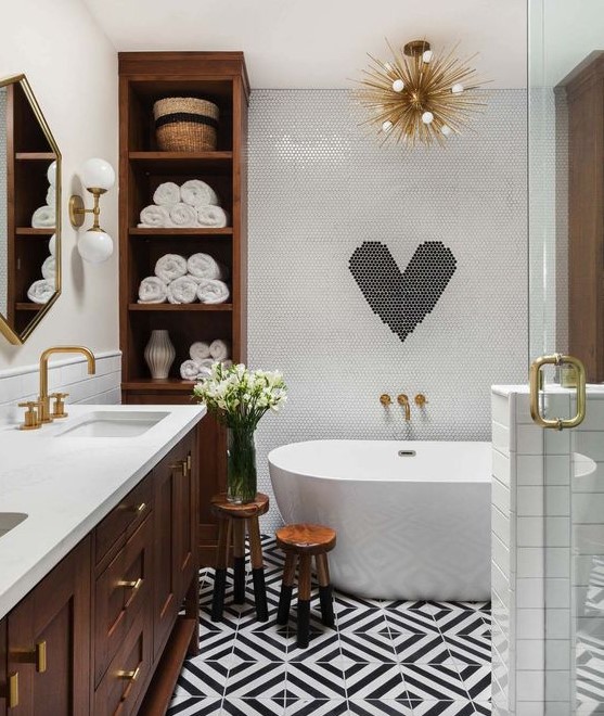 a contemporary meets mid century odern bathroom in black and white with much rich colored wood and gilded touches