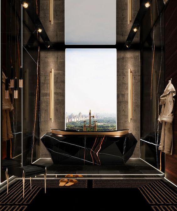 a jaw-dropping gold and black bathroom with a window for a view, a black rock tub on a platform, built-in lights is wow