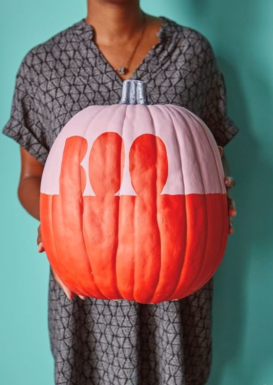 a matte pink and orange Halloween pumpkin with letters is a very cool and fresh idea to rock, simple and graphic