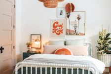 a mid-century modern girl bedroom with a white bed and pastel bedding, woven stools, green nightstands, a woven lamp and a gallery wall