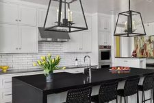 a mid-century modern kitchen with white shaker cabinets, a white skinny tile backsplash, a black and white kitchen island and black woven stools