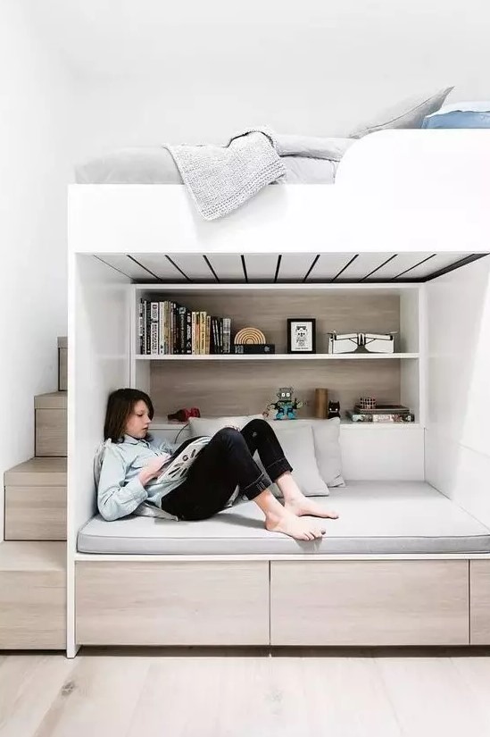 a minimalist teen room with a loft bedroom and a study and reading space down, with storage and built in shelves is great