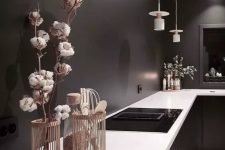 a moody black kitchen design