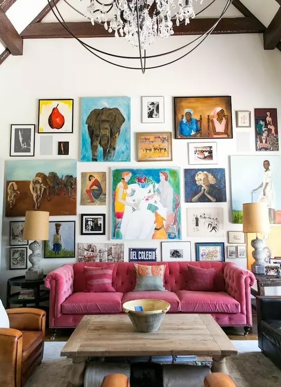 a super bright gallery wall with bold artworks with frames and without them, in bold colors and with a free form for a creative touch