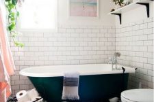 an eclectic bathroom with potted greenery, black and white tiles on the floor and touches of blush