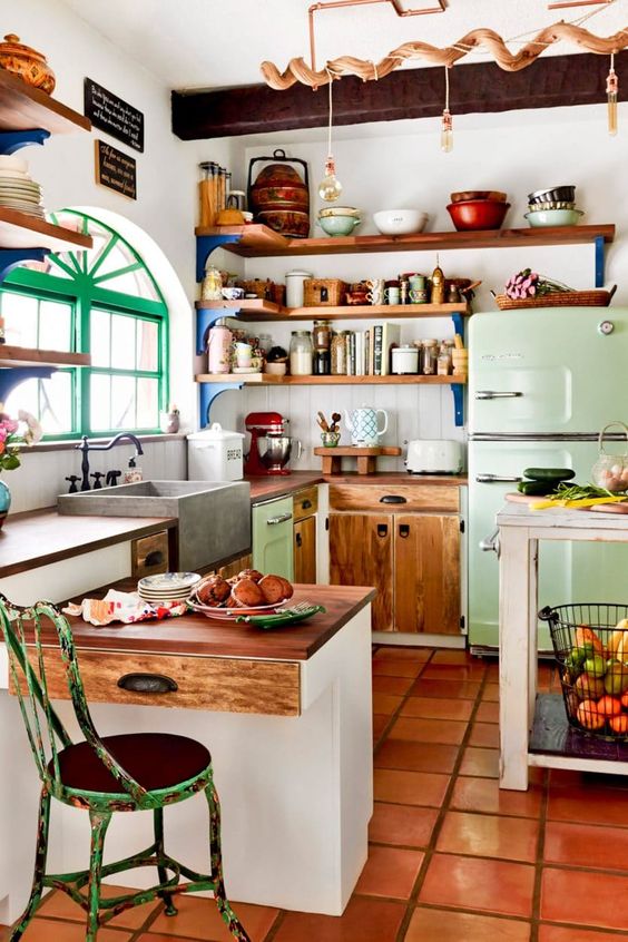 an eclectic kitchen with stained cabinets and open shelves, a mini kitchen island, a green stool and window frames