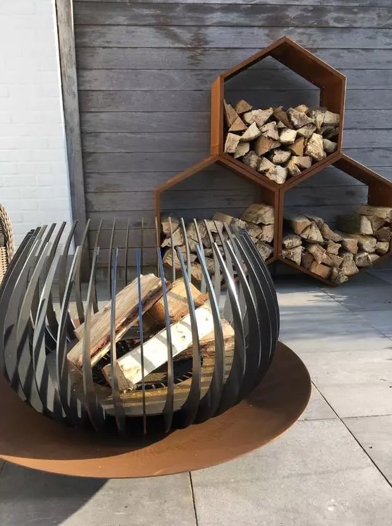 an eye catchy modern fire bowl on a metal stand will let you enjoy all the flames while it's on fire