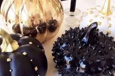 black and copper pumpkins decorated with spikes, studs and beads look very bold and cool