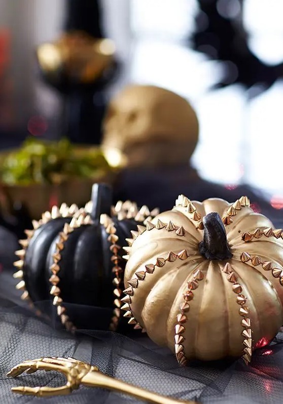 black and gold faux pumpkins with spikes are lovely for fall and Halloween and look very glam rock