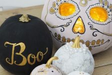 faux pumpkins painted as a sugar skull and a lantern, with letters, leaves and pearls are amazing for Halloween
